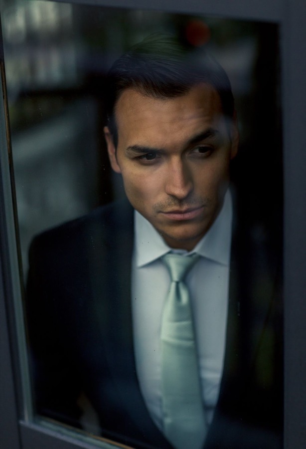 A man in a suit, lost in thought